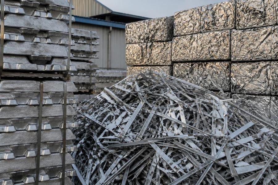 Secondary aluminium supply — aluminium ingots, alloys and scrap bales for domestic and export markets Aluminium ingots and compacted aluminium scrap bales in a metals yard